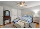 Cozy bedroom with hardwood floors, comfortable bed, ample closet space, and natural light at 7918 Yester Ct, Raleigh, NC 27615