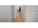Hallway with hardwood floors that leads to a room in the distance at 7918 Yester Ct, Raleigh, NC 27615