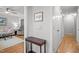 Neutral hallway featuring wood floors, a dark wood accent table and decor at 7918 Yester Ct, Raleigh, NC 27615
