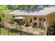 Picturesque outdoor patio with a table, chairs, and a tidy garden at 7918 Yester Ct, Raleigh, NC 27615