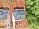 This is an aerial view of the roof of this new construction home with a large lot surrounded by mature trees at 7932 Wexford Waters Ln, Wake Forest, NC 27587