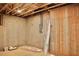 Unfinished basement with exposed wooden rafters at 7932 Wexford Waters Ln, Wake Forest, NC 27587