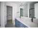 Modern bathroom with dual sinks, and a glass shower at 7932 Wexford Waters Ln, Wake Forest, NC 27587