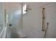 Elegant bathroom shower with marble-like tile, a built-in bench, and bronze shower fixtures at 7932 Wexford Waters Ln, Wake Forest, NC 27587