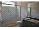 Bathroom features tile shower and sink at 7932 Wexford Waters Ln, Wake Forest, NC 27587