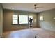 Spacious bedroom with three windows and hardwood floors at 7932 Wexford Waters Ln, Wake Forest, NC 27587