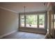 Elegant dining room with large windows at 7932 Wexford Waters Ln, Wake Forest, NC 27587