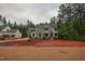 New construction home with gray siding, a three-car garage, and a large yard at 7932 Wexford Waters Ln, Wake Forest, NC 27587