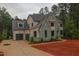 Two-story home boasts attached garage, manicured lawn, and neutral color palette at 7932 Wexford Waters Ln, Wake Forest, NC 27587