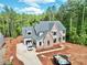 Beautiful new construction with manicured front yard, brick facade, and attached garage at 7932 Wexford Waters Ln, Wake Forest, NC 27587
