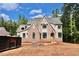 New construction home with brick facade, grey roof, and black window frames at 7932 Wexford Waters Ln, Wake Forest, NC 27587