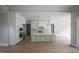 Open kitchen with large island, breakfast bar, and stainless steel appliances at 7932 Wexford Waters Ln, Wake Forest, NC 27587