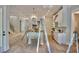 Bright, spacious kitchen with large island, modern appliances, and access to staircase at 7932 Wexford Waters Ln, Wake Forest, NC 27587