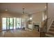 Spacious living room boasts a fireplace, large sliding doors, and staircase access at 7932 Wexford Waters Ln, Wake Forest, NC 27587
