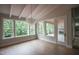 Bright living room with hardwood flooring, fireplace, and large windows at 7932 Wexford Waters Ln, Wake Forest, NC 27587