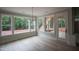 Bright room with large windows, and stairs to outside, offering scenic views at 7932 Wexford Waters Ln, Wake Forest, NC 27587