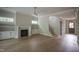 Spacious living room boasts hardwood floors, built-in shelves, and fireplace at 7932 Wexford Waters Ln, Wake Forest, NC 27587