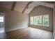Airy bedroom with vaulted ceiling, large windows, and beautiful hardwood floors at 7932 Wexford Waters Ln, Wake Forest, NC 27587