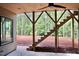 This home features an outdoor staircase that leads to a deck with views of a lovely wooded lot at 7932 Wexford Waters Ln, Wake Forest, NC 27587