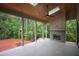 Screen porch with a fireplace, wood ceiling, and great views of the backyard at 7932 Wexford Waters Ln, Wake Forest, NC 27587