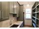 Scullery with dark green cabinetry and shelving provides ample space for storage and prep at 7932 Wexford Waters Ln, Wake Forest, NC 27587