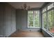 Bright sun room featuring large windows and hardwood floors at 7932 Wexford Waters Ln, Wake Forest, NC 27587