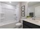 Bright bathroom boasts a tub-shower combo, contemporary vanity, and stylish decor accents at 87 Addison Pond Ct # 12, Zebulon, NC 27597
