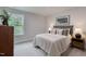 Comfortable bedroom featuring plush carpet, natural light, and neutral decor at 87 Addison Pond Ct # 12, Zebulon, NC 27597