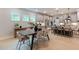 Open concept dining area and kitchen with barstool seating and ample natural light at 87 Addison Pond Ct # 12, Zebulon, NC 27597