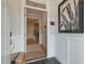 A welcoming foyer with decorative wall paneling leads to a view of the open-concept living space at 87 Addison Pond Ct # 12, Zebulon, NC 27597