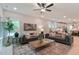 Open living room featuring comfortable seating, a large window, and decor with a neutral color palette at 87 Addison Pond Ct # 12, Zebulon, NC 27597