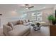 Inviting living room features a large sectional sofa and ceiling fan at 87 Addison Pond Ct # 12, Zebulon, NC 27597