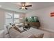 Stylish living room includes a large sectional, TV, and plant at 87 Addison Pond Ct # 12, Zebulon, NC 27597