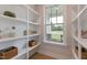 Well-organized pantry with natural light shining through a large window, showing ample storage space at 87 Addison Pond Ct # 12, Zebulon, NC 27597