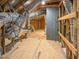 Attic view featuring plywood flooring, exposed framework, and ductwork, highlighting the potential for customization at 87 Addison Pond Ct, Zebulon, NC 27597