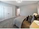 Relaxing bedroom featuring natural light, soft textures, and simple decor for a serene retreat at 87 Addison Pond Ct, Zebulon, NC 27597