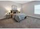 Inviting bedroom features neutral colors and comfortable furnishings for a restful retreat at 87 Addison Pond Ct, Zebulon, NC 27597
