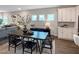 Modern dining room featuring a dark wood table, six chairs, and stylish decor at 87 Addison Pond Ct, Zebulon, NC 27597