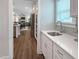Butler pantry features additional cabinets, countertop space, and sink, conveniently located off the open-concept kitchen at 87 Addison Pond Ct, Zebulon, NC 27597
