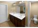 A bathroom featuring double sinks and a large mirror at 8844 Forester Ln, Apex, NC 27539