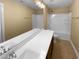 A bathroom featuring double sinks and a shower/tub combination at 8844 Forester Ln, Apex, NC 27539