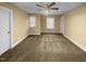 A spacious bedroom with a ceiling fan and two windows bringing in natural light at 8844 Forester Ln, Apex, NC 27539