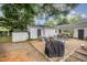Landscaped backyard offers a patio area with an outdoor kitchen, perfect for entertaining at 903 S 2Nd St, Smithfield, NC 27577