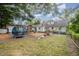 Large backyard featuring mature trees, a play structure, and plenty of space for outdoor activities at 903 S 2Nd St, Smithfield, NC 27577