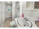 Bright bathroom with a large mirror, vanity, and convenient storage at 903 S 2Nd St, Smithfield, NC 27577