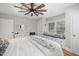 Bright bedroom with a ceiling fan, window seat, and built-in storage at 903 S 2Nd St, Smithfield, NC 27577