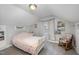 Cozy bedroom with a sloped ceiling, plush carpet, and natural light at 903 S 2Nd St, Smithfield, NC 27577