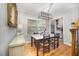 Dining room with wooden floor and view into the kitchen at 903 S 2Nd St, Smithfield, NC 27577