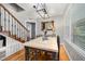 Charming dining room featuring hardwood floors, stylish light fixture, and ample natural light at 903 S 2Nd St, Smithfield, NC 27577