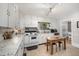 Bright kitchen featuring tile floors, granite countertops and stainless steel appliances at 903 S 2Nd St, Smithfield, NC 27577